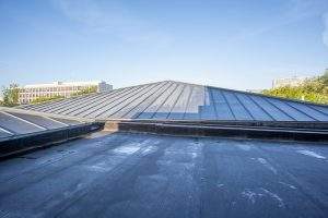 in a big city there is a flat roof on a high building